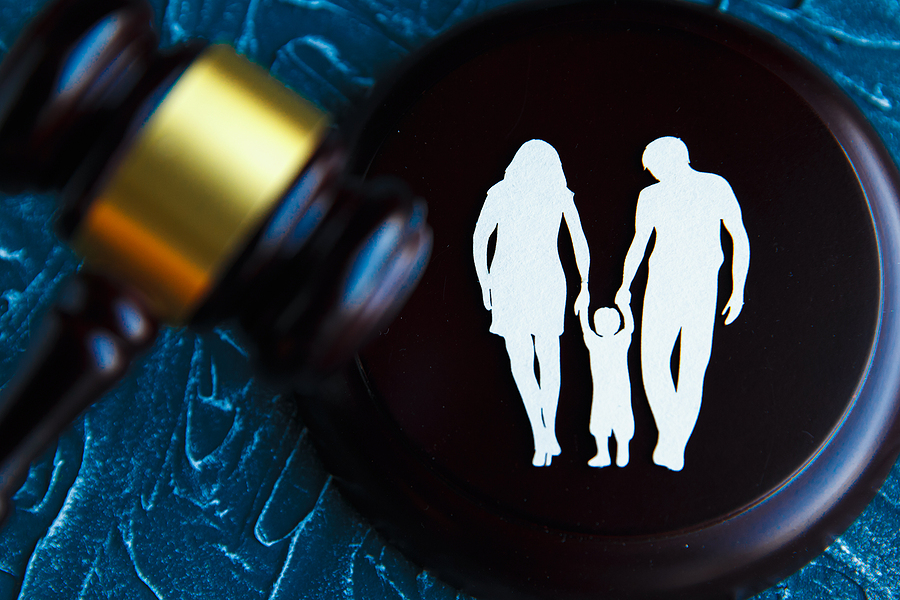 Gavel and a picture of a family. Family Law concept