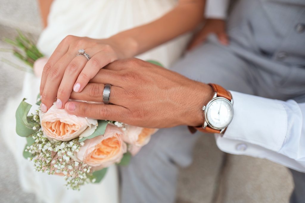Couple wearing wedding rings in Brisbane